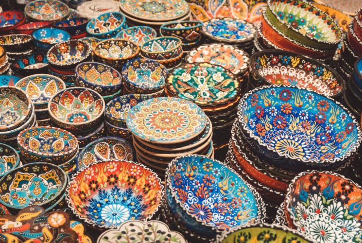 A variety of bright colored Mexican pottery dishes